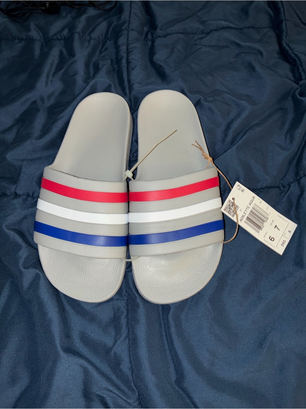 adidas Women’s Light Gray Slide Sandals with Red, White & Blue Stripes